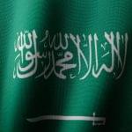 Detailed close-up of the Saudi Arabian flag showcasing the elegant Arabic script and vibrant green color.